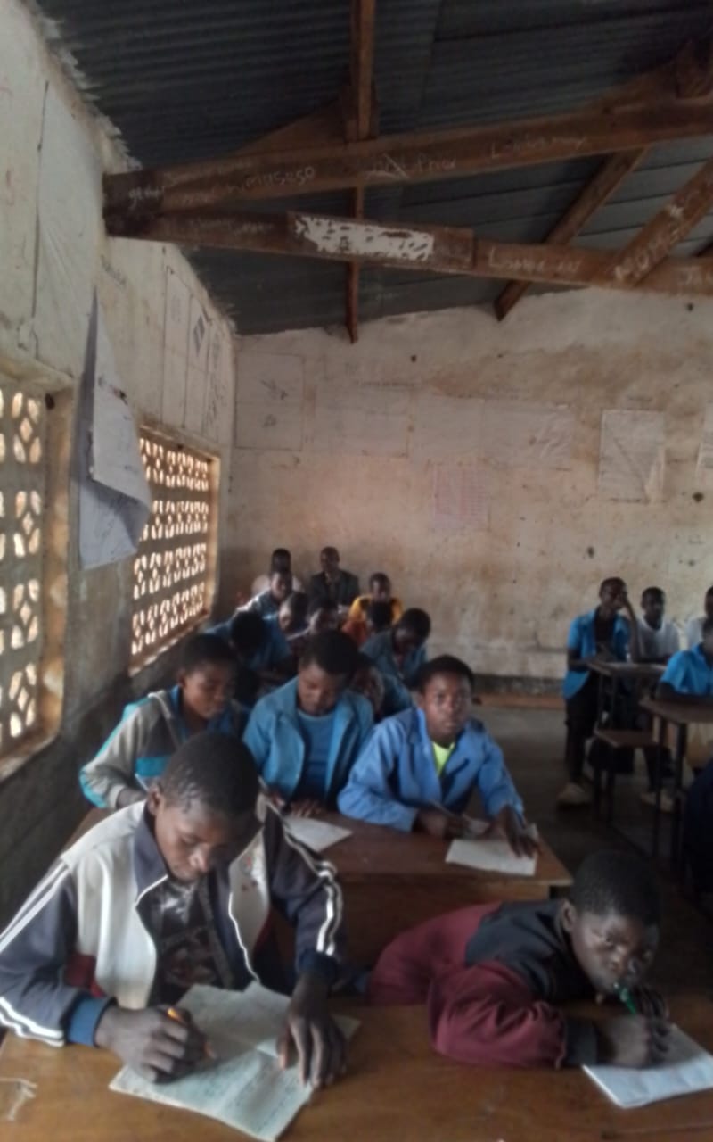 Chipata Primary School learners completing written classwork at shared desks