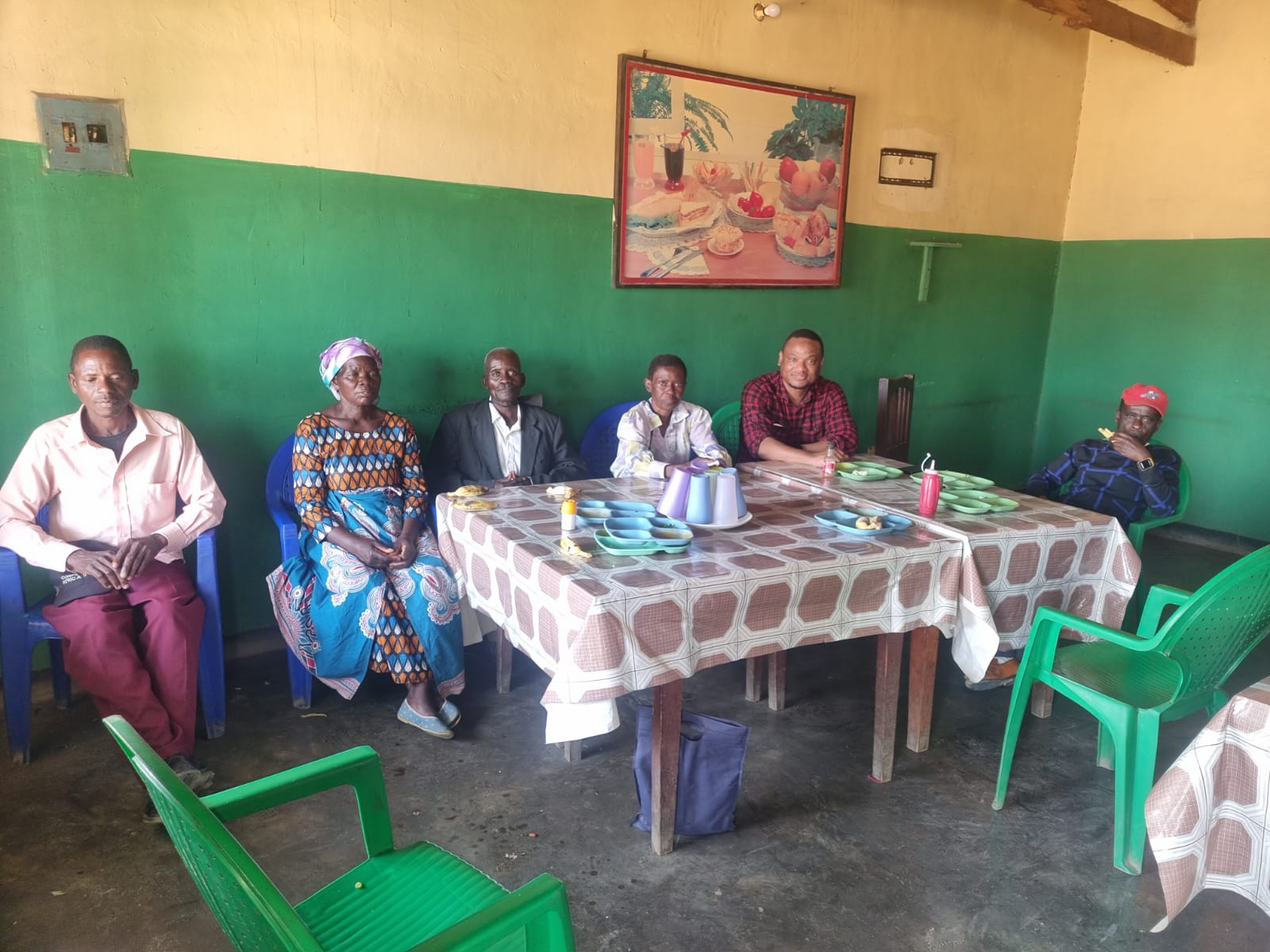 Village leaders and community representatives in discussion